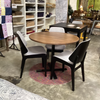 Dining table with chairs in a showroom setting