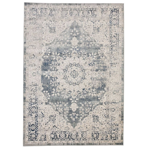 Decorative light grey rug with a grey/blue floral pattern 
