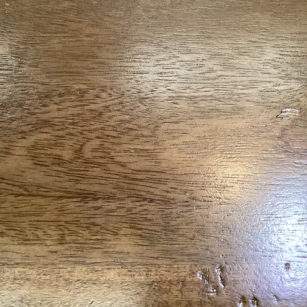 Close-up of a wooden surface with visible grain and texture