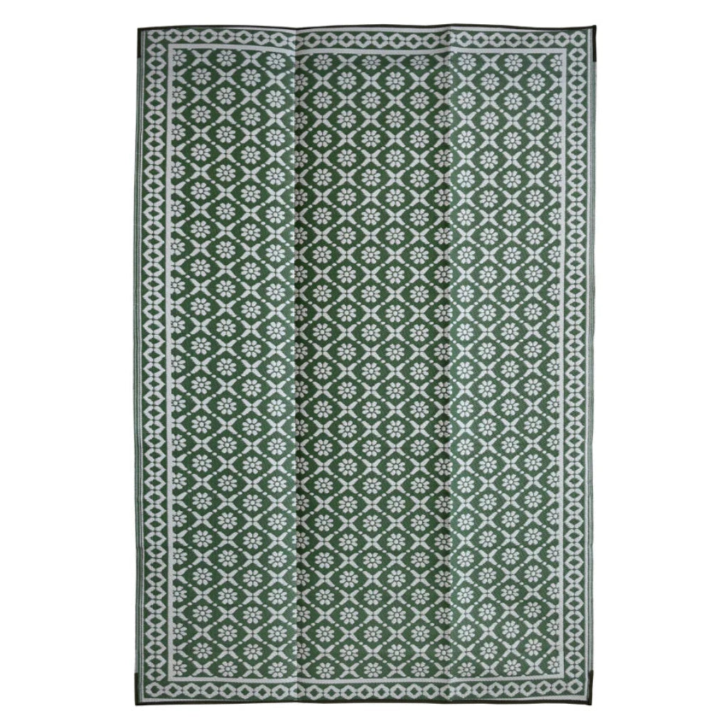 Green and white patterned rug on a white background