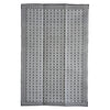 Patterned rug with geometric design on a white background