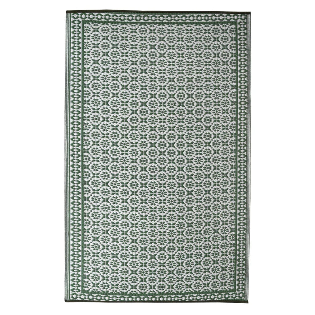 Green and white patterned rug on a white background