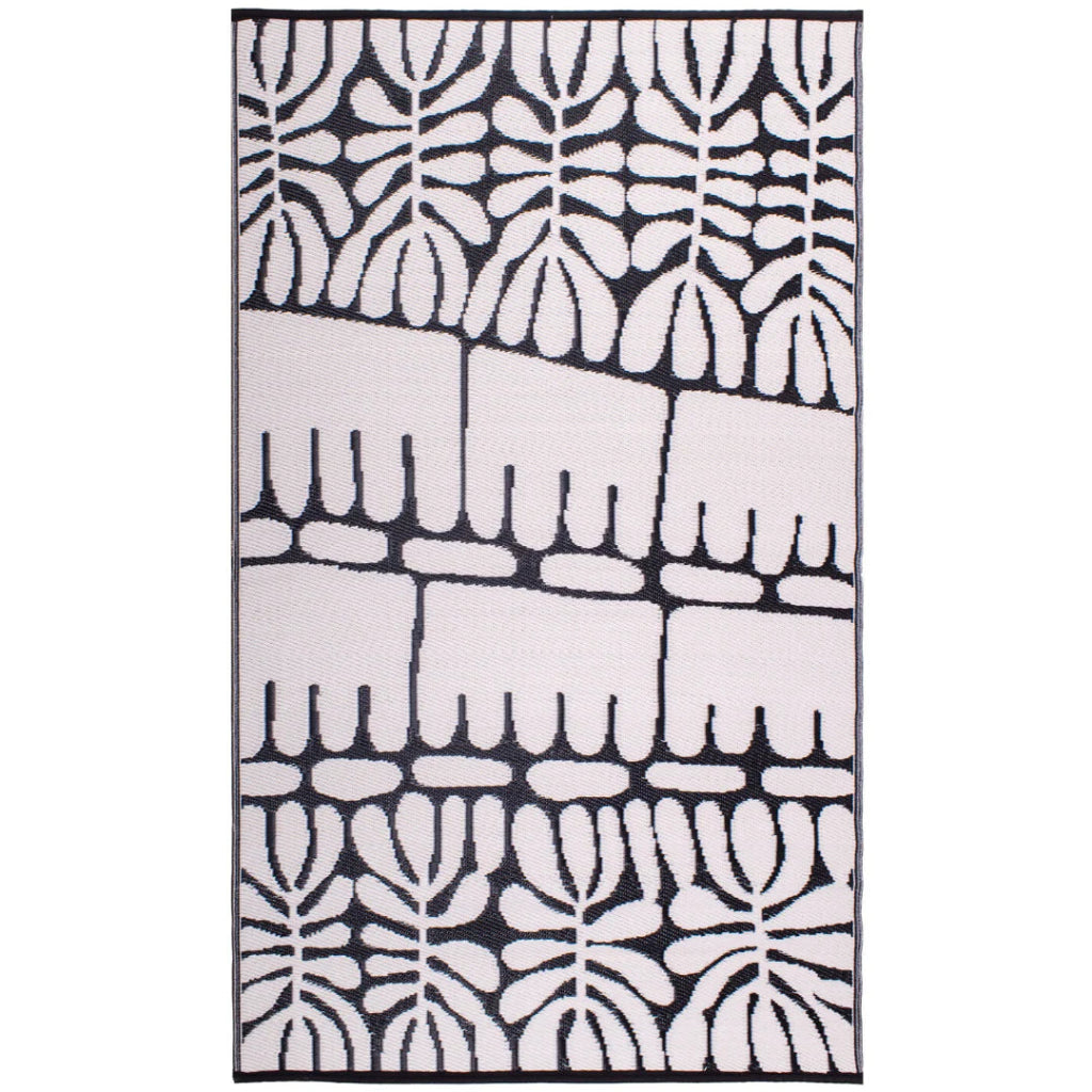 Rug with black and white abstract pattern on a white background